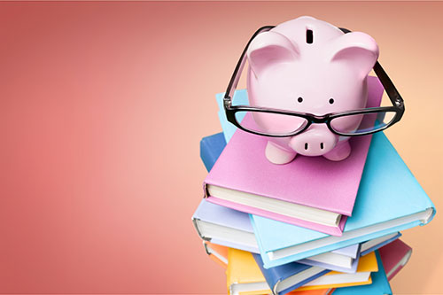 Piggy bank on books